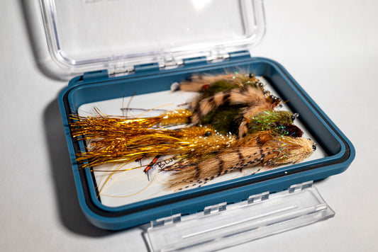 bundle of redfish flies in a plan d fly box