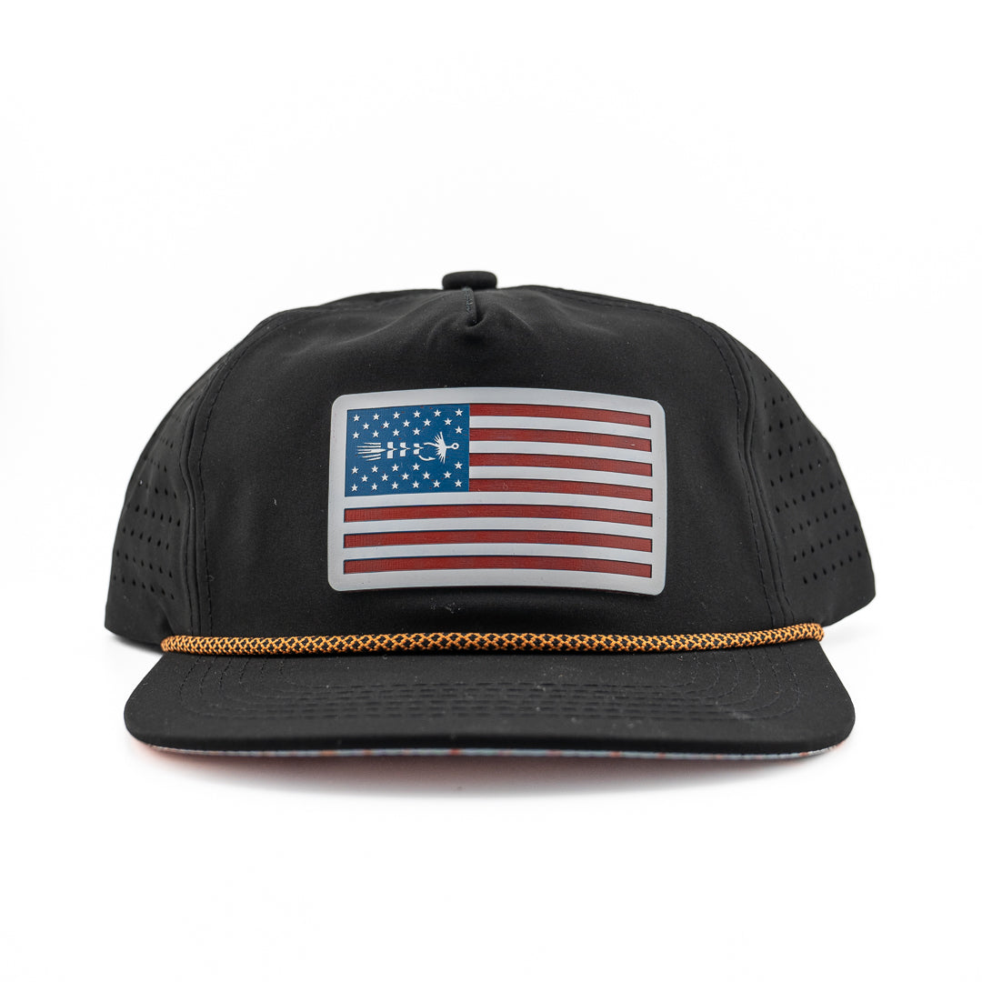 Front view of Skiff Wanderer Redfish Hat featuring leather patch and rope trim